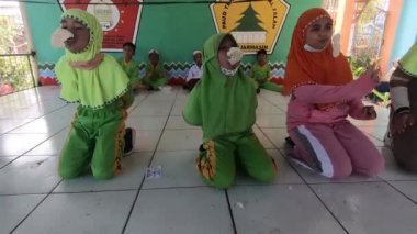 Children in a competition eating crackers, on the event of Indonesia's Independence Day.4K video footage. South Kalimantan, Indonesia. August 18, 2022.