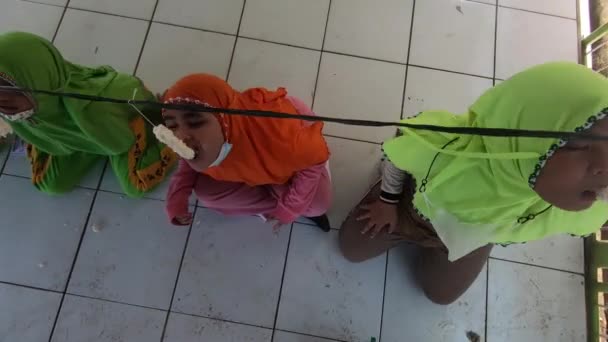Children Who Looking Trying Eat Crackers Hanging Video Footage South — Stockvideo