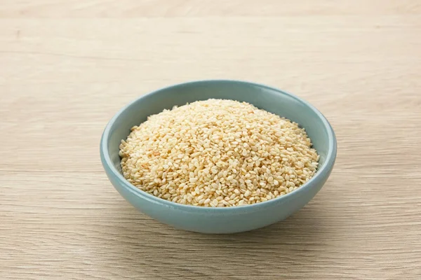 stock image Organic White Sesame Seeds (Sesamum indicum) or Wijen, served in small bowl on wooden background