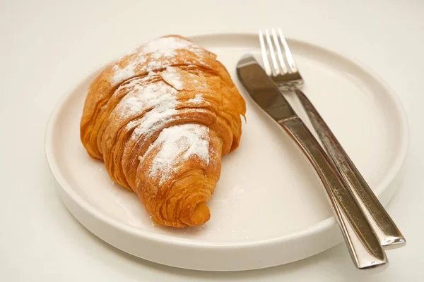 Tasty Croissant Sprinkling Icing Sugar White Plate White Background — Stock Photo, Image