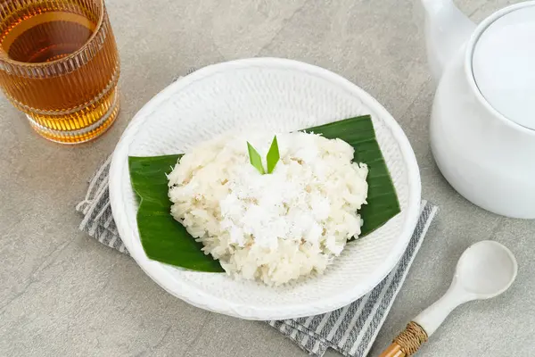 Stock image Ketan Kelapa Parut, Indonesian traditional snack, made from steamed glutinous rice and served with grated coconut