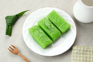 Wajik, traditional Indonesian snack made from steamed sticky rice, sugar, coconut milk, and pandan leaves.  clipart