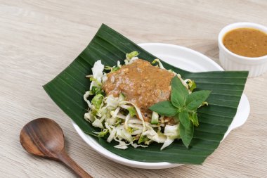 Karedok, raw vegetable salad with peanut sauce dressing, Sundanese signature dish. Indonesian food clipart