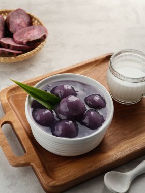 Bubur candil or Candil porridge, made from purple sweet potato cooked with coconut milk, sugar and pandan leaves, tastes is sweet and delicious. Indonesian food clipart