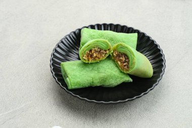Kue dadar gulung (Hindistan cevizli tatlı krep), Hindistan cevizi rendelenmiş palmiye şekerli Endonezya tatlısı.. 