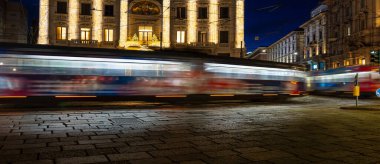  Christmas Scenes - Trails of light in the dark in Piazza Cordusio in Milan, Italy on 12-21-2024 clipart