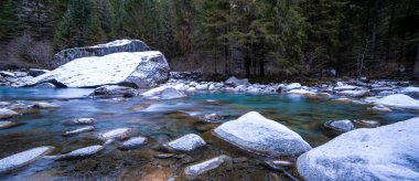 Spectacular Dolomite landscape on the turquoise stream clipart