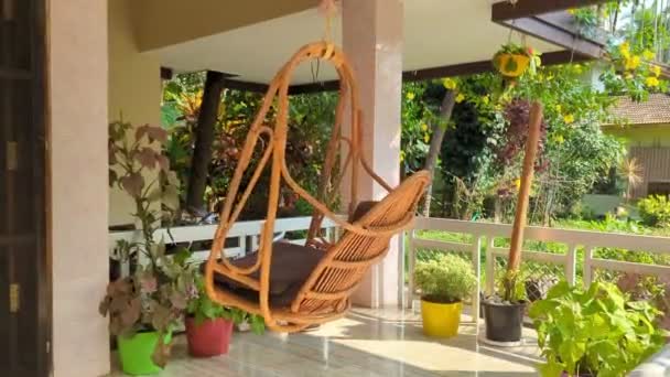 Hanging Chair Swing Made Wood Swinging Wind Veranda Surrounded Plants — Stock video
