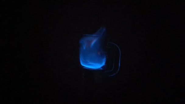 Lighting Alcohol Blue Flame Burning Glass Cup Glowing Dark Background — Stock Video