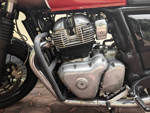 closeup of the internal combustion engine and gearbox motor of powertrain of a motorcycle