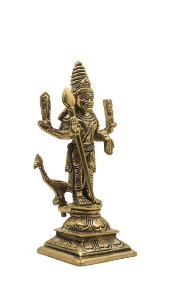 sculpture in gold of hindu god of war subramanya, son of lord shiva with his animal, a peacock isolated in a white background