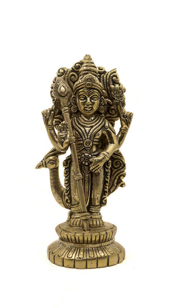 antique golden statue of hindu god of war subramanya, son of lord shiva with his animal, a peacock isolated in a white background