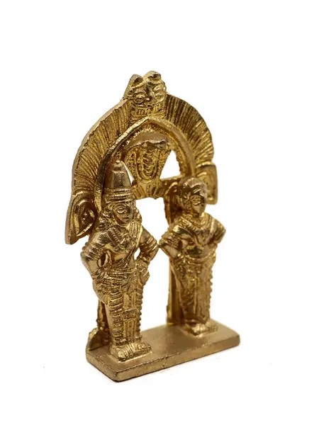 stock image antique statue of god and goddess couple handcrafted in gold, deities of myth from hindu religion of worship isolated in a white background
