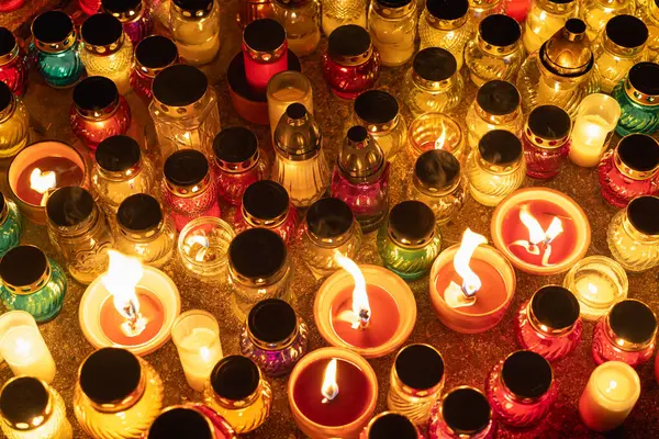 stock image colorful candle jars glowing warmly in the night.