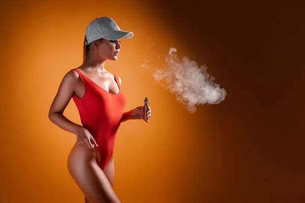 Young Beautiful Woman Red Swimsuit Cap Hold Vape Hand While — Stock Photo, Image