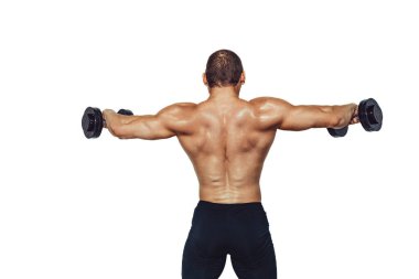 Strong bodybuilder man doing exercises with dumbbells while showing his back on white background. Copy Space 