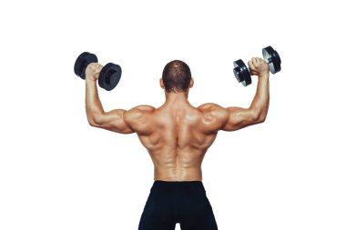 Athletic muscular man doing exercises with dumbbells while showing his back on white background. 