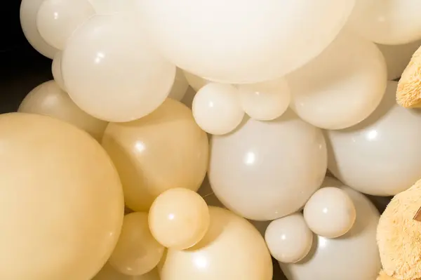 Photo zone made of balloons in cream and pastel shades