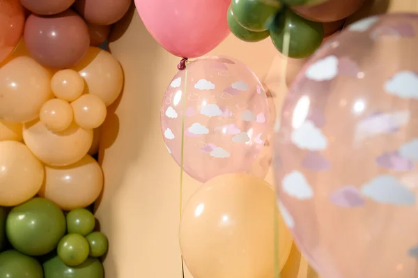 Photo zone made of balloons in cream and pastel shades