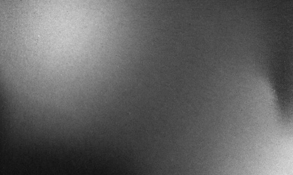 Dark gray silver background with brushed metal effect and rough, grungy grain texture. Monochromatic design, ideal for industrial themes, stainless steel visuals, or modern minimalistic backdrops.