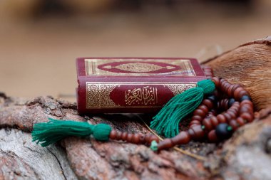 Islamic prayer beads and Quran.