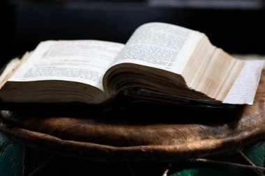 African church. Sunday catholic mass. Old bible on a djembe.  Agbonou Koeroma. Togo. 