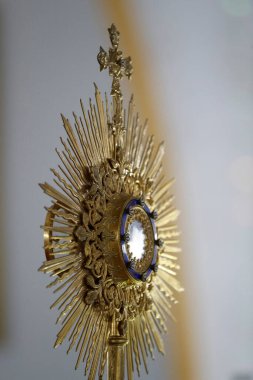 The Blessed Sacrament in a monstrance. Eucharist adoration.  Hue.  Vietnam. 
