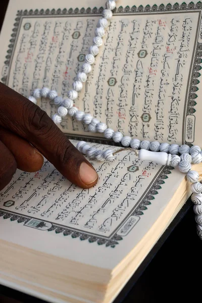 Islamic prayer beads and Quran. Togo.