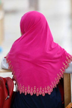 Muslim girl learning Quran at Islamic school. 