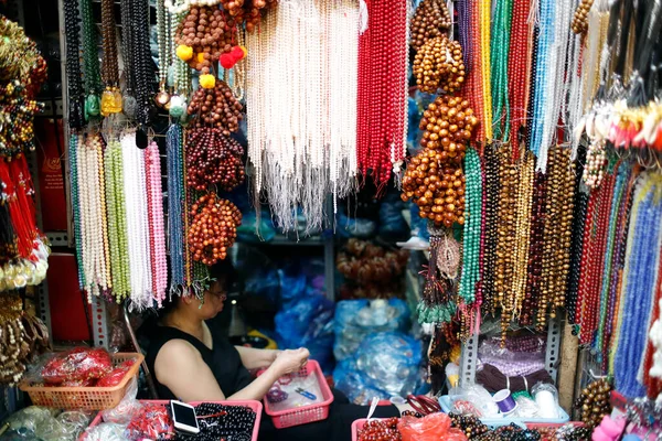 Buddhist shop at market. Prayer beads.  Hanoi. Vietnam.