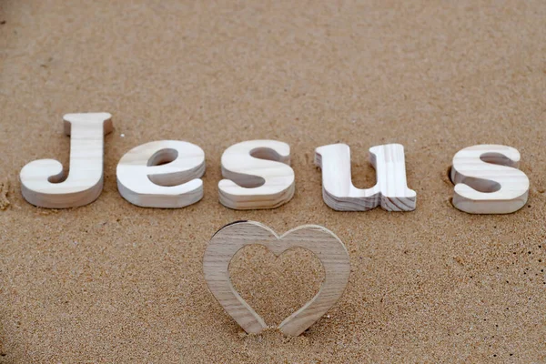 Wooden Letters Forming Word Jesus Heart Background Beach Sand Christian — Stock Photo, Image