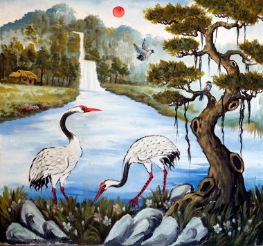 Huynh Quang Budist tapınağı. Asya Turnaları ve Çam Ağacı. Resim yapmak. Chau Doc. Vietnam. 