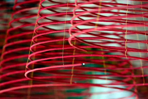 Huynh Dao Buddhist temple.  Red incense coils hang from the ceiling. Chau Doc. Vietnam.