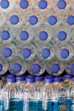 Rows of plastic bottles of drinking water.  Kuala Lumpur. Malaysia. 