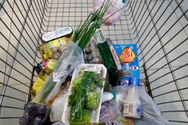 Trolley with groceries in a supermarket.  Quy Nhon. Vietnam. 
