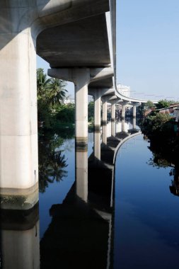 Poor quality housing, brand new buildings and new metro bridge.  Ho Chi Minh City. Vietnam. 