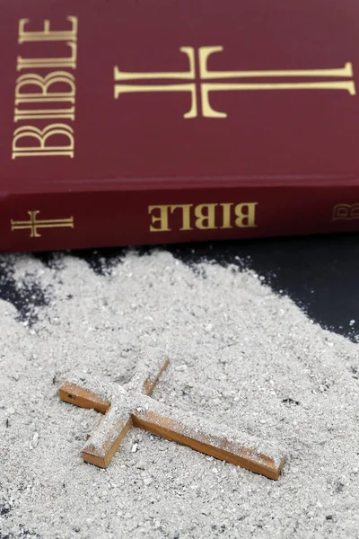 Ashes, cross and bible. Ash Wednesday celebration. Lent season.