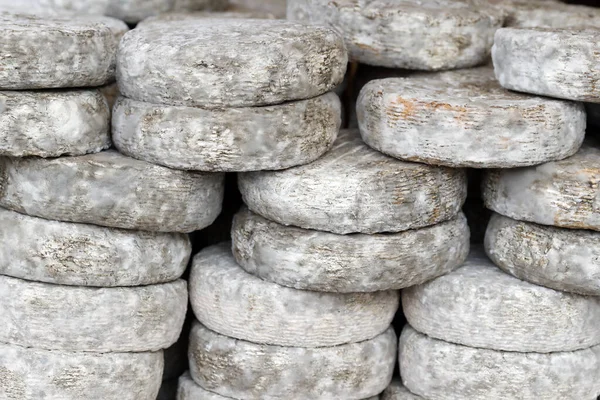 stock image Traditional french cheese for sale at market.  Tomme.  France. 