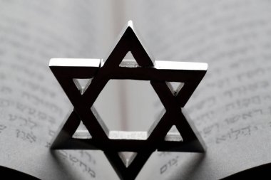Jewish star or star of David on a Torah.  Religious symbol.  clipart