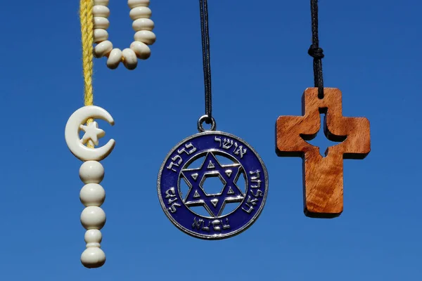 Christianity, Islam, Judaism  3  monotheistic religions. Jewish  Star of Davis, islamic cross and crescent and christian cross.  Interreligious symbols.