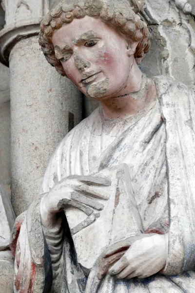 stock image Saint John, the evangelist.  Painted portal.  Cathedral of Notre Dame of Lausanne.  Switzerland.