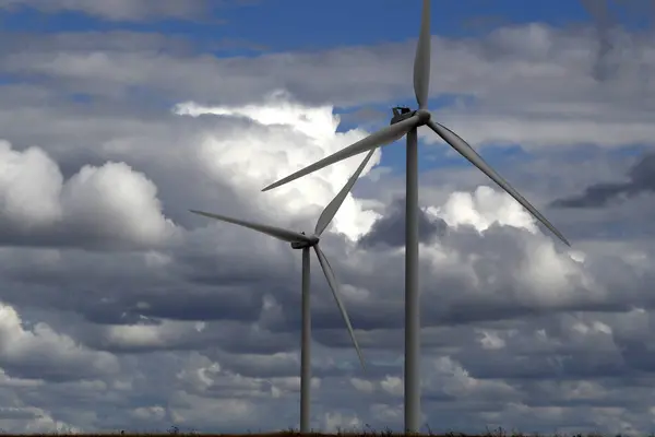 stock image Wind power or wind energy is the use of wind to provide the mechanical power through wind turbines to turn electric generators.  France. 