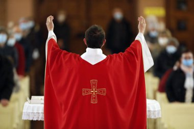 Saint Joseph des Fins church. Catholic mass. Holy week.  Eucharist celebration.  Annecy. France. clipart