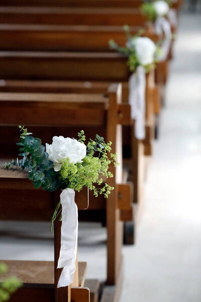 Flower decoration in church. Wedding ceremony. 