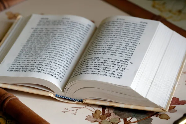 Open torah on a table. Jewish book.