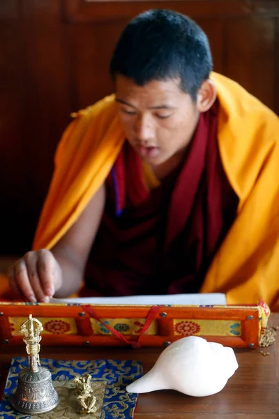 stock image Ganesh Saraswati buddhist temple. Monk at ceremony. Ritual attributes of Buddhism : vajra and  bell. Dakshinkali. Nepal. 