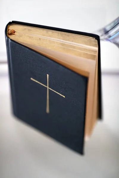 stock image Bible with cross on a table. 