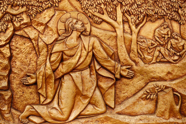 Sanctuary of Fatima.  Golden bas-relief of the old Basilica of Fatima representing one of the fourteen mysteries of the rosary, similar to the stations of the cross. Jesus is in the Garden of Gethsemane. Portugal. 