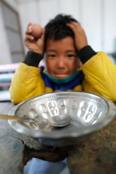 stock image Student getting lunch.  Primary school.  Charikot. Nepal. 