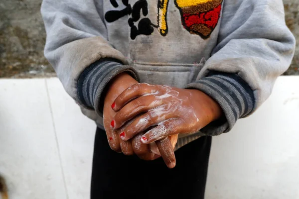 Stock image Primary school. Boy school wash his hands with soap in the sink.  Nepal. 